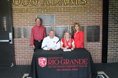 Xenia High's Laurel Amstutz poses with her parents and Rio Grande coach Callum Morris after signing with the RedStorm